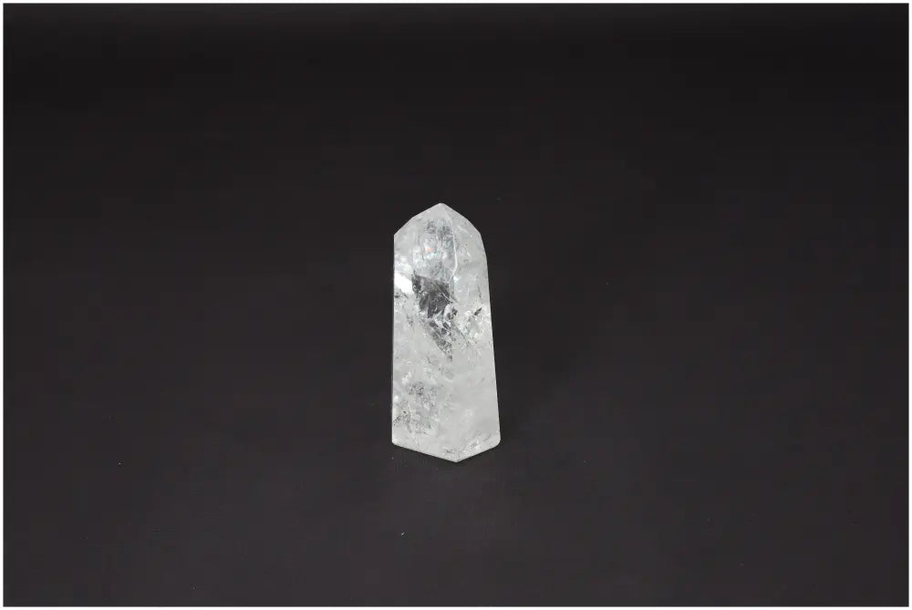Lemurian Quartz Obelisk on black background displaying unique spiritual and energetic properties, supports various chakras.