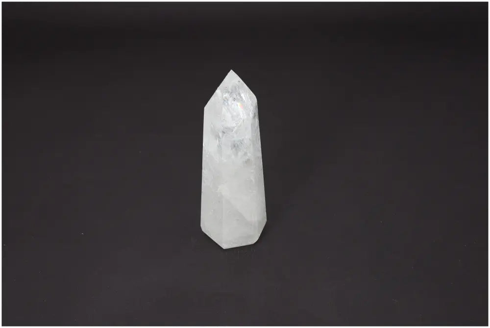 Lemurian Quartz Obelisk on dark background showcasing its unique color and properties tied to chakras and zodiac signs.