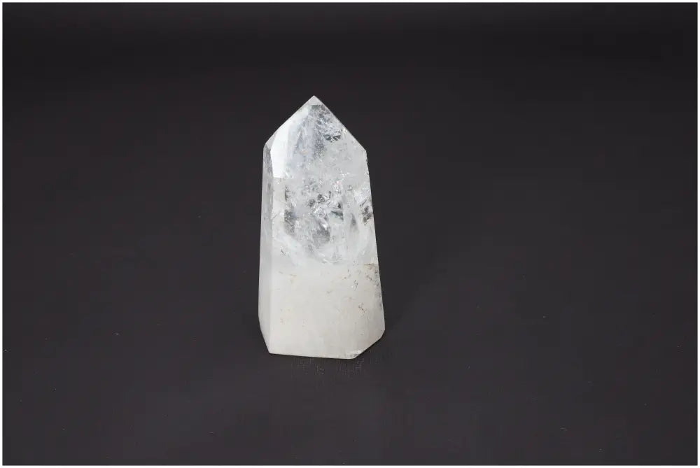 Lemurian Quartz Obelisk on black background showcasing unique properties for chakras and zodiac signs.