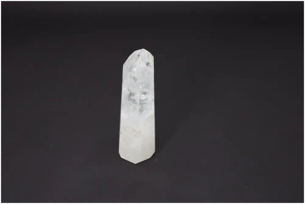 Lemurian Quartz Obelisk on black background, highlighting unique spiritual properties and chakra alignment for energetic balance.