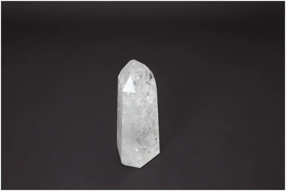 Lemurian Quartz Obelisk on dark background, enhancing energetic and spiritual needs with unique crystal properties.