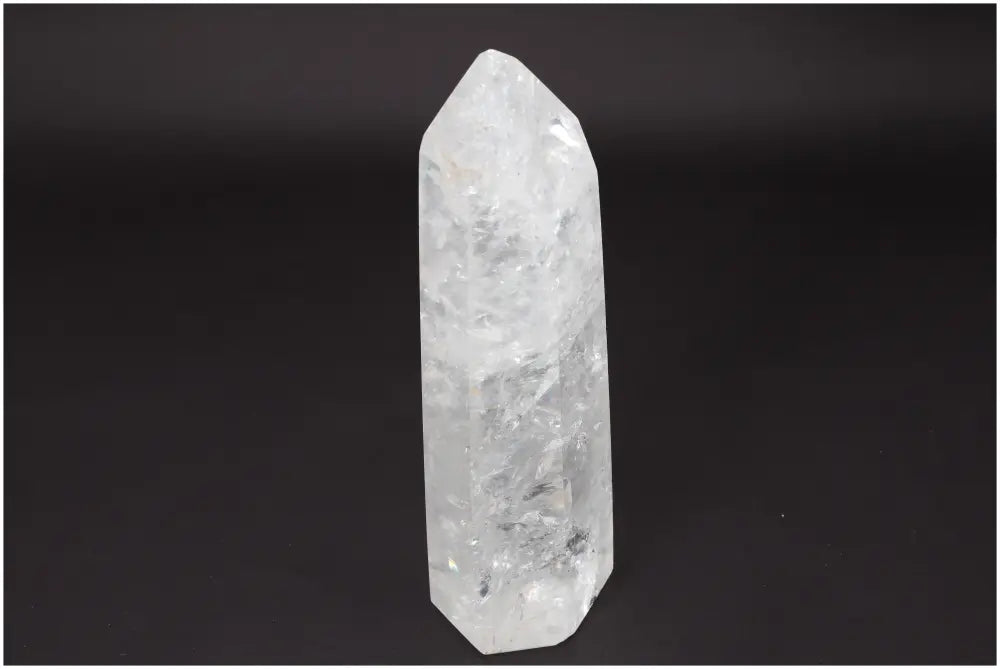 Lemurian Quartz Obelisk crystal on black background, powerful stone for clarity and energy amplification.