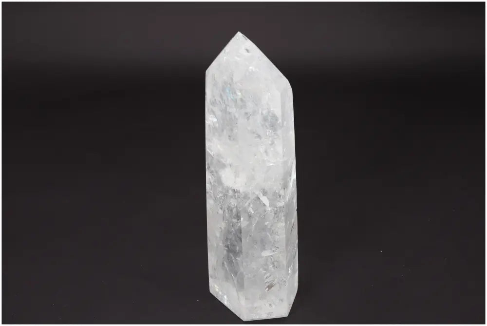 Lemurian Quartz Obelisk on black background, ethically sourced clear quartz crystal used for clarity, balance, and personal growth.