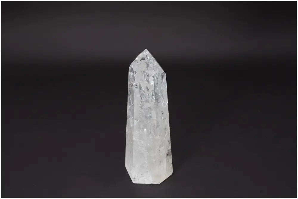 Lemurian Quartz Obelisk crystal on dark background, embodying clarity and balance for personal growth.