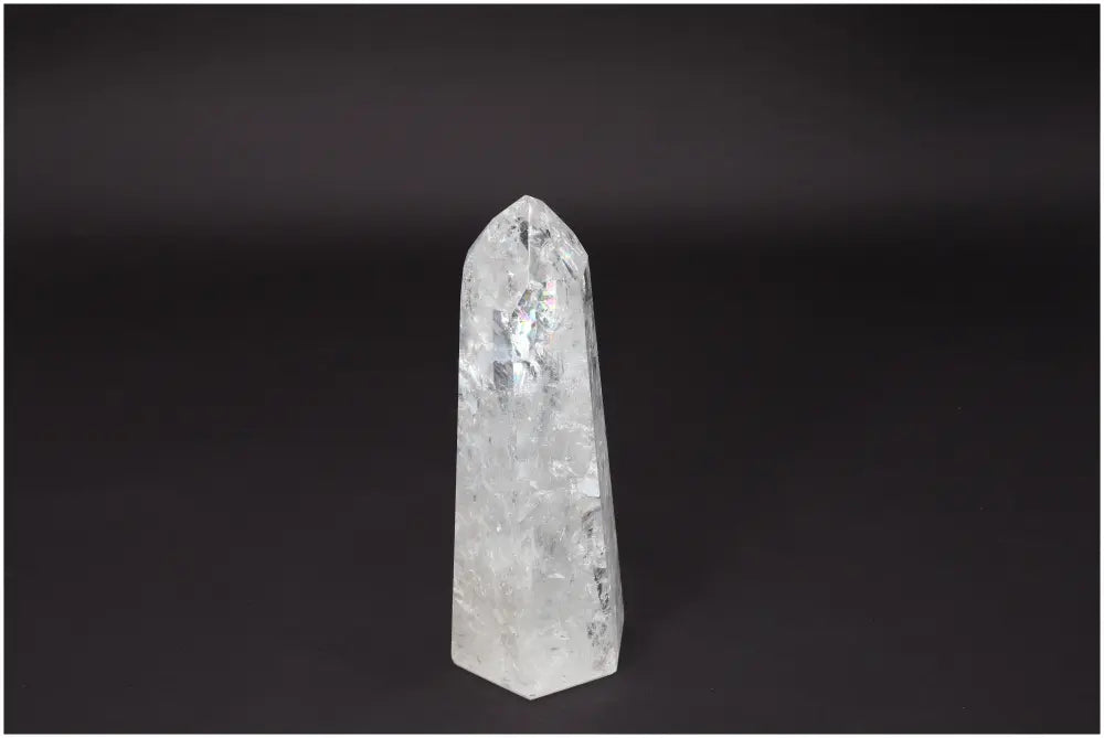 Lemurian Quartz Obelisk crystal on black background, promoting clarity, balance, and personal growth; known as "Master Healer."