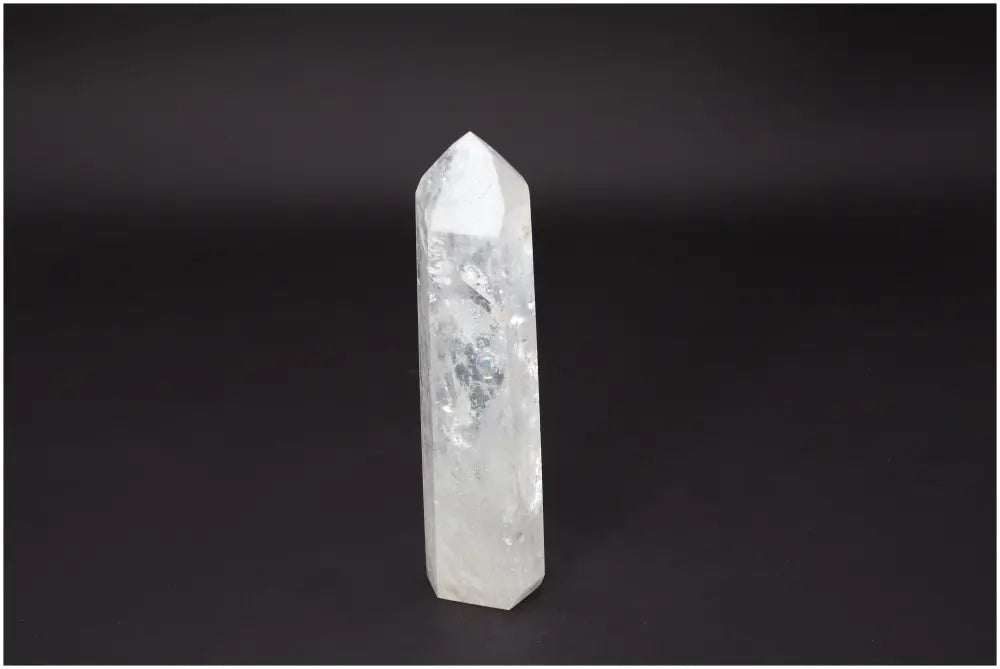 Lemurian Quartz Obelisk crystal on a dark background, known for clarity, balance, and growth in personal energy work.