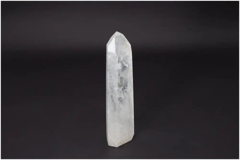 Lemurian Quartz Obelisk - Clear Quartz crystal for clarity, balance, and growth on a dark background. Master Healer stone.