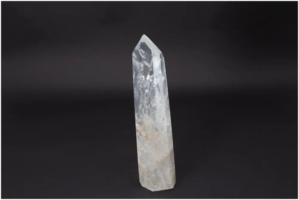 Lemurian Quartz Obelisk on black background, known for clarity and healing properties, ethically sourced and naturally formed.