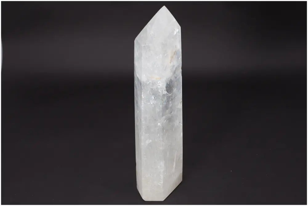 Lemurian Quartz Obelisk crystal, known as "Master Healer," for clarity, balance, and personal growth on black background