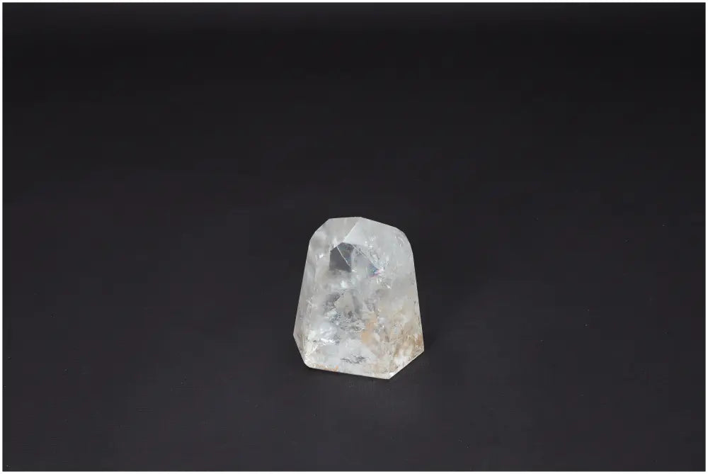 Lemurian Quartz Obelisk on black background, a clear crystal known for energy amplification and healing properties, ethically sourced.