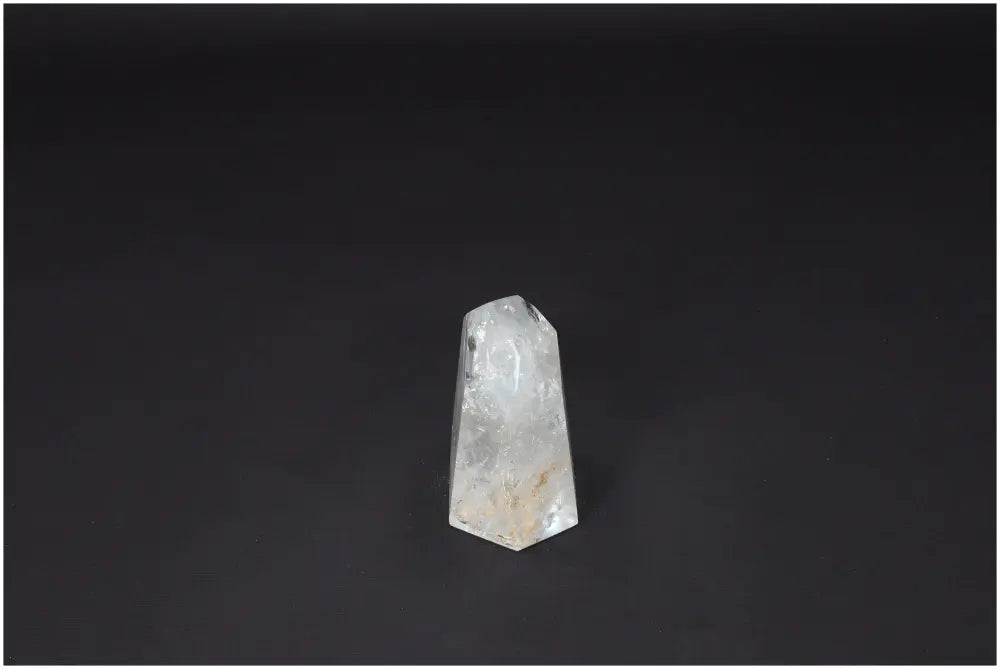 Lemurian Quartz Obelisk on black background showcasing unique crystal clarity and healing properties.