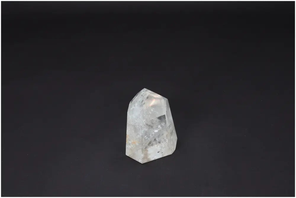 Lemurian Quartz Obelisk on dark background, exemplifying clarity and balance for personal growth. Master Healer crystal for amplified energy.