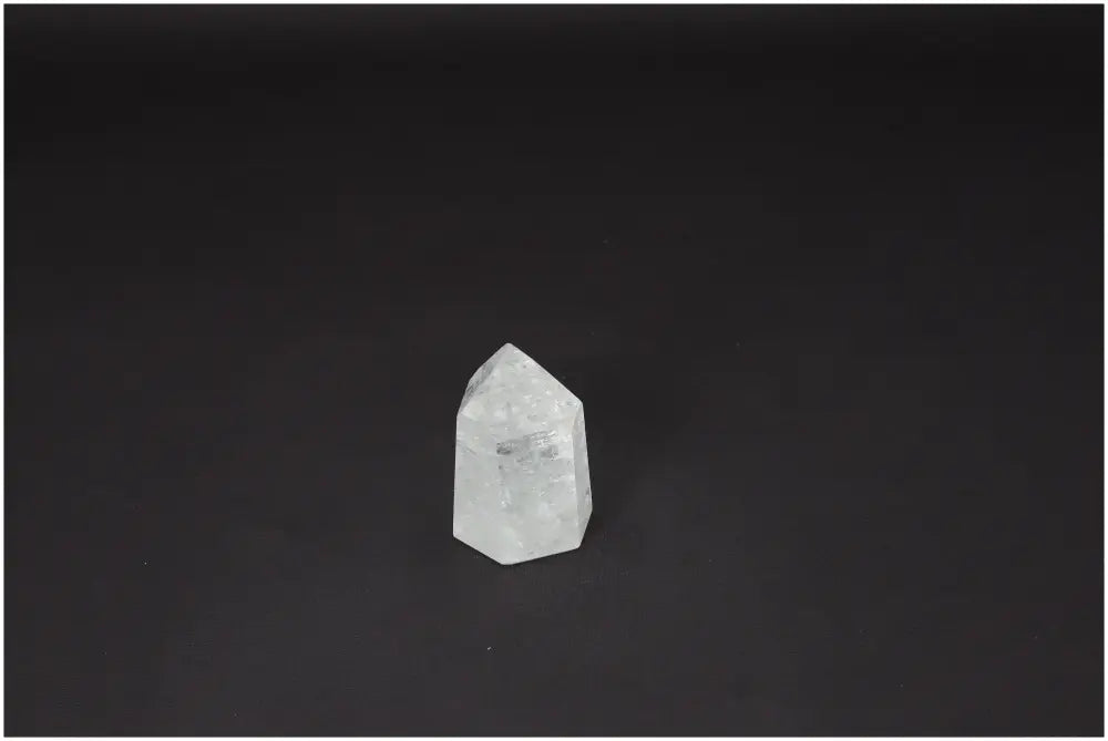 Lemurian Quartz Obelisk on black background, known for enhancing clarity and balance. Ethically sourced, naturally formed crystal.