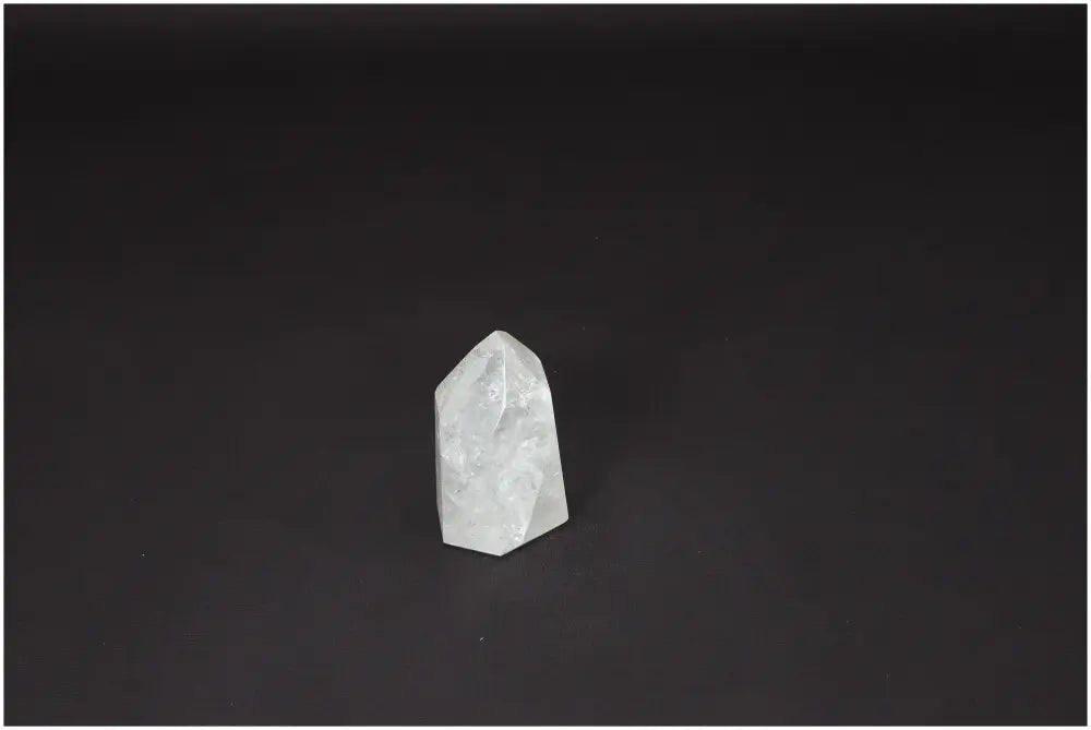 Lemurian Quartz Obelisk on black background, enhancing clarity and balance. Ethically sourced and naturally formed crystal.