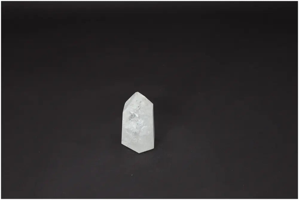 Lemurian Quartz Obelisk crystal on a dark background, known for energy amplification and personal growth, ethically sourced and naturally formed.