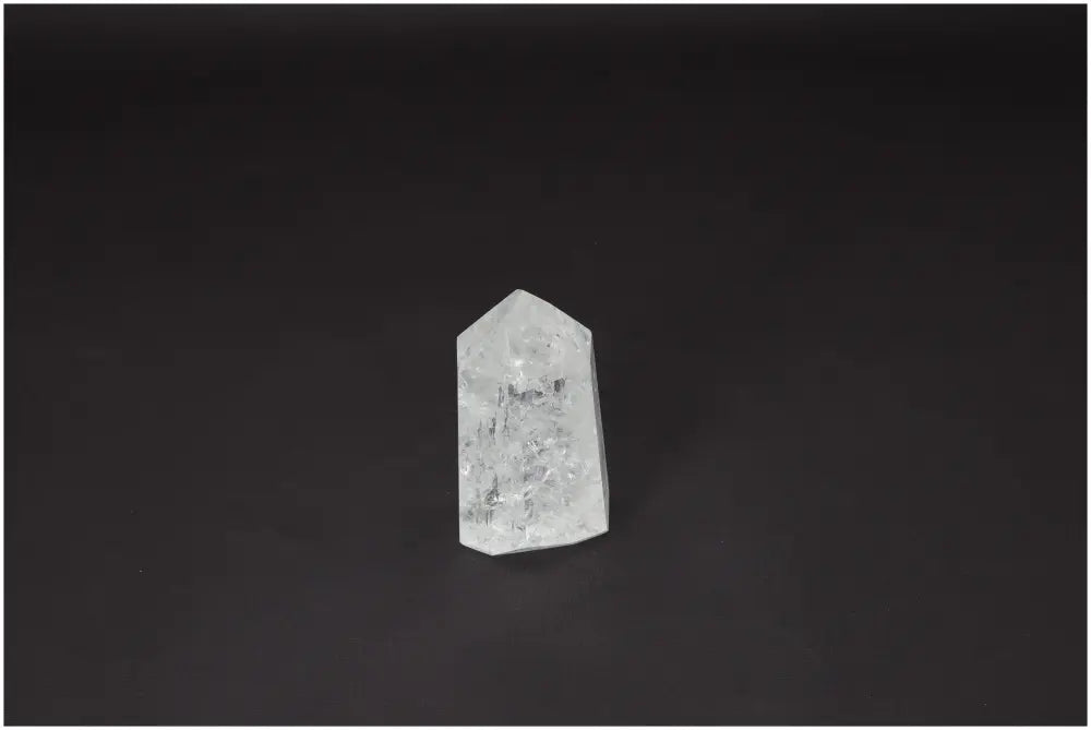 Lemurian Quartz Obelisk on black background, symbolizing clarity, balance, and personal growth in crystal healing practices.
