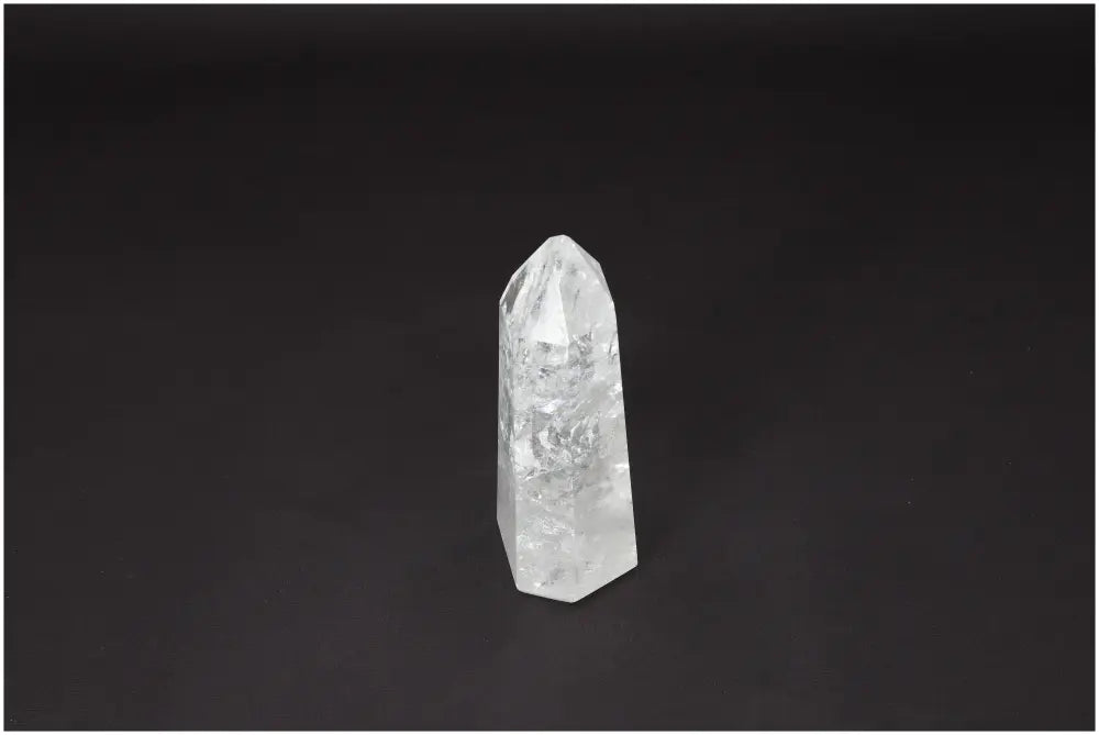 Lemurian Quartz Obelisk Crystal for Healing and Clarity on Black Background