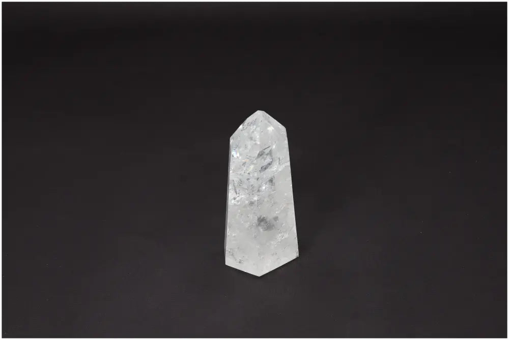 Lemurian Quartz Obelisk against black background, known for clarity, balance, and energy amplification; hand-selected and ethically sourced.