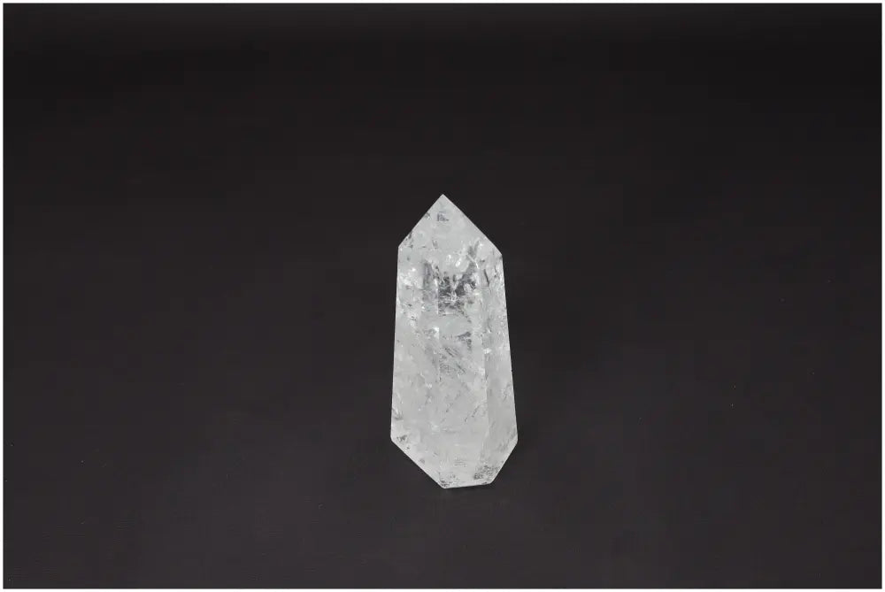 Lemurian Quartz Obelisk on black background, showcasing its clarity and natural formation. Ideal for energy amplification and balance.