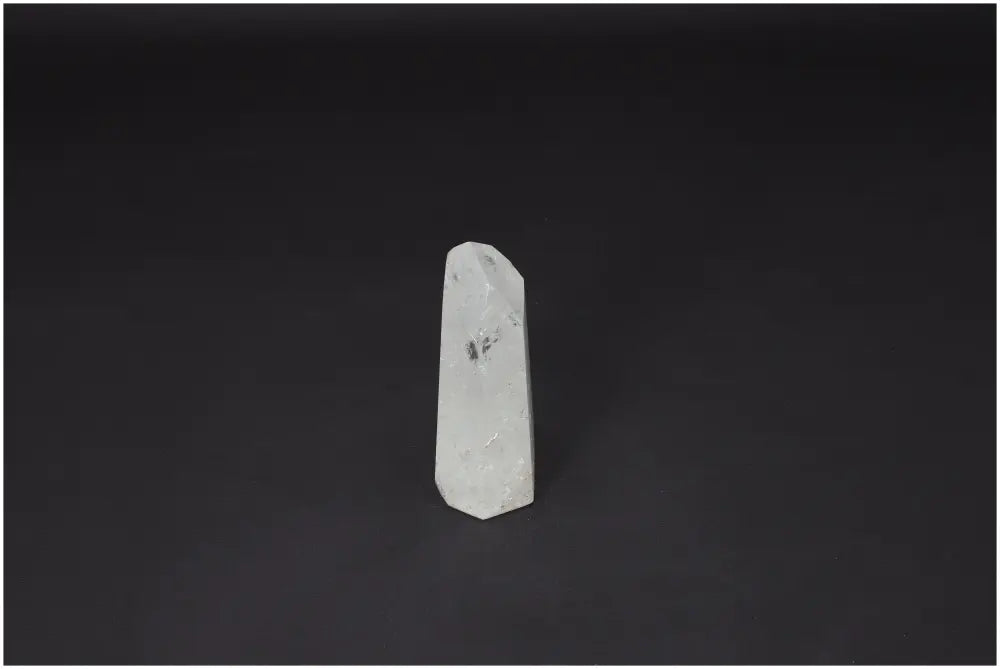 Lemurian Quartz Obelisk on black background, known for enhancing clarity, balance, and personal growth in crystal healing practices.