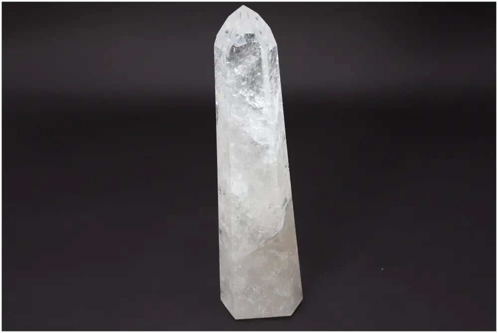 Lemurian Quartz Obelisk crystal on a dark background, symbolizing clarity and balance; known as the Master Healer in crystal healing.