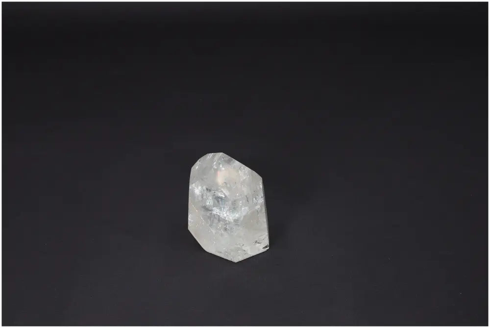 Lemurian Quartz Obelisk crystal on a dark background, known for amplifying energy and promoting clarity, balance, and personal growth.