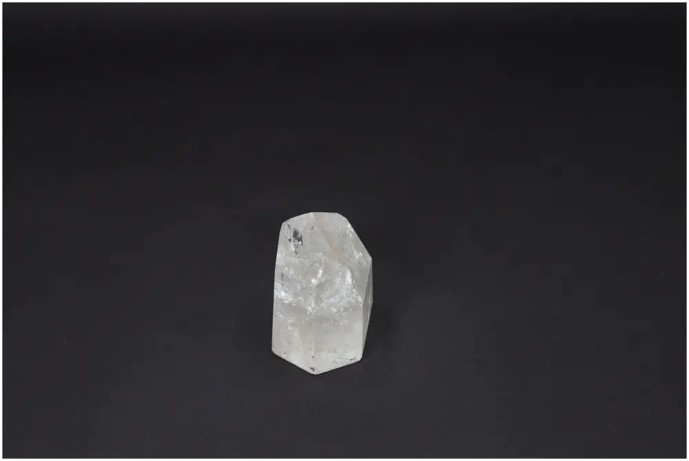 Lemurian Quartz Obelisk on black background, a powerful crystal for clarity, balance, and personal growth, ethically sourced and natural.