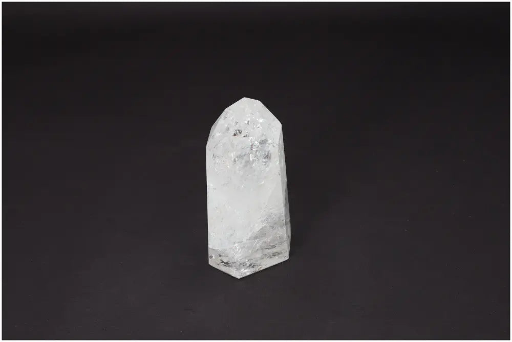 Lemurian Quartz Obelisk on black background, known as Master Healer crystal, enhances clarity and balance, ethically sourced