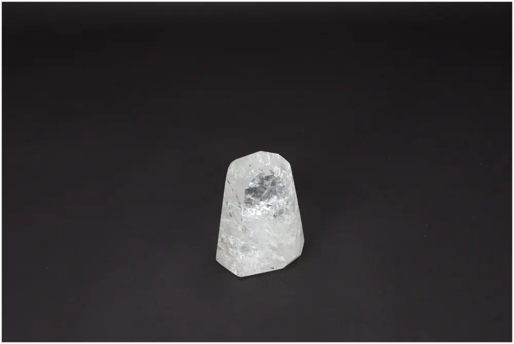 Lemurian Quartz Obelisk crystal on a dark background, known as the "Master Healer" for clarity and personal growth.