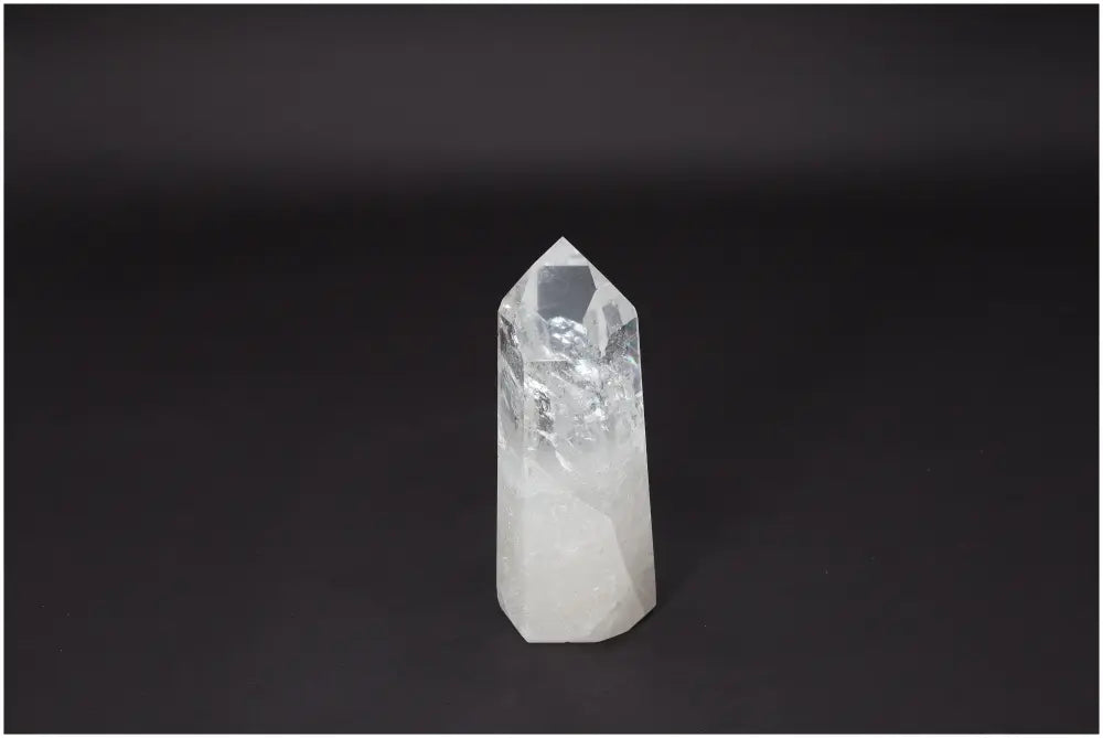 Lemurian Quartz Obelisk crystal on black background, known as a "Master Healer," for clarity, balance, and personal growth.