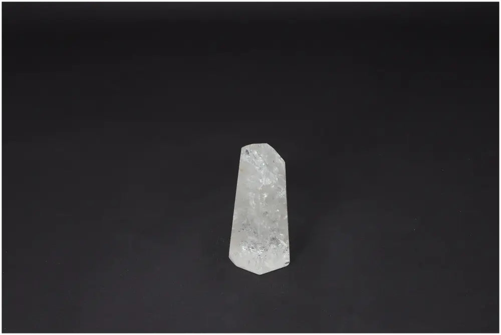 Lemurian Quartz Obelisk on black background, a hand-selected clear crystal for clarity, balance, and personal growth.