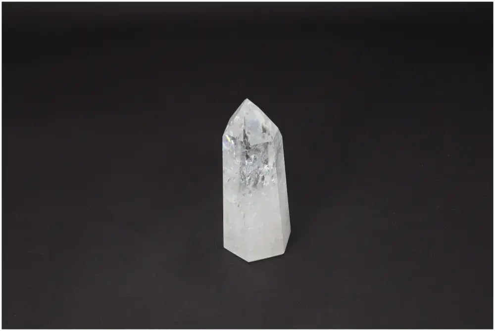 Lemurian Quartz Obelisk, Clear Quartz crystal on black background, master healer for clarity and balance.