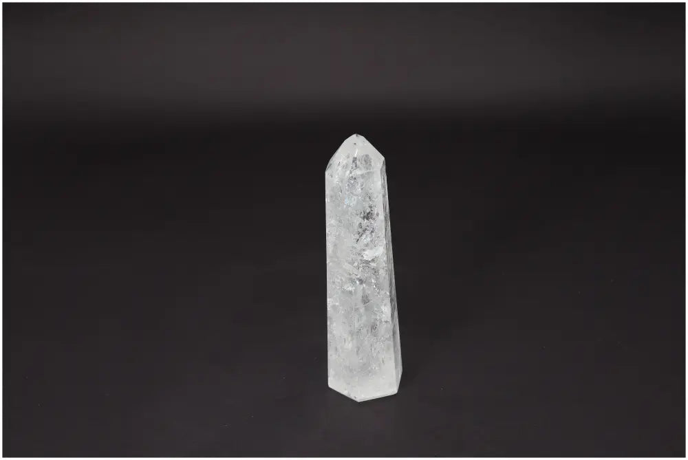 Lemurian Quartz Obelisk on a dark background, representing clarity and balance, known as the Master Healer in crystal therapy.