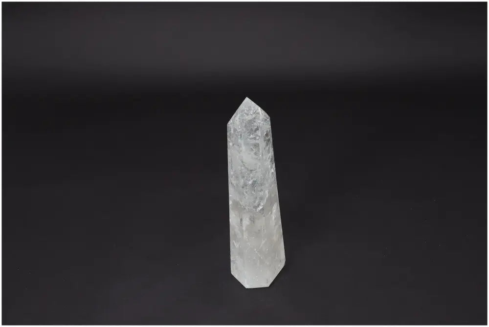 Lemurian Quartz Obelisk crystal against a dark background, symbolizing clarity, balance, and personal growth; Master Healer stone.
