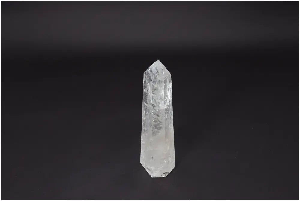 Lemurian Quartz Obelisk on black background, showcasing natural beauty and clarity for healing and energy amplification.