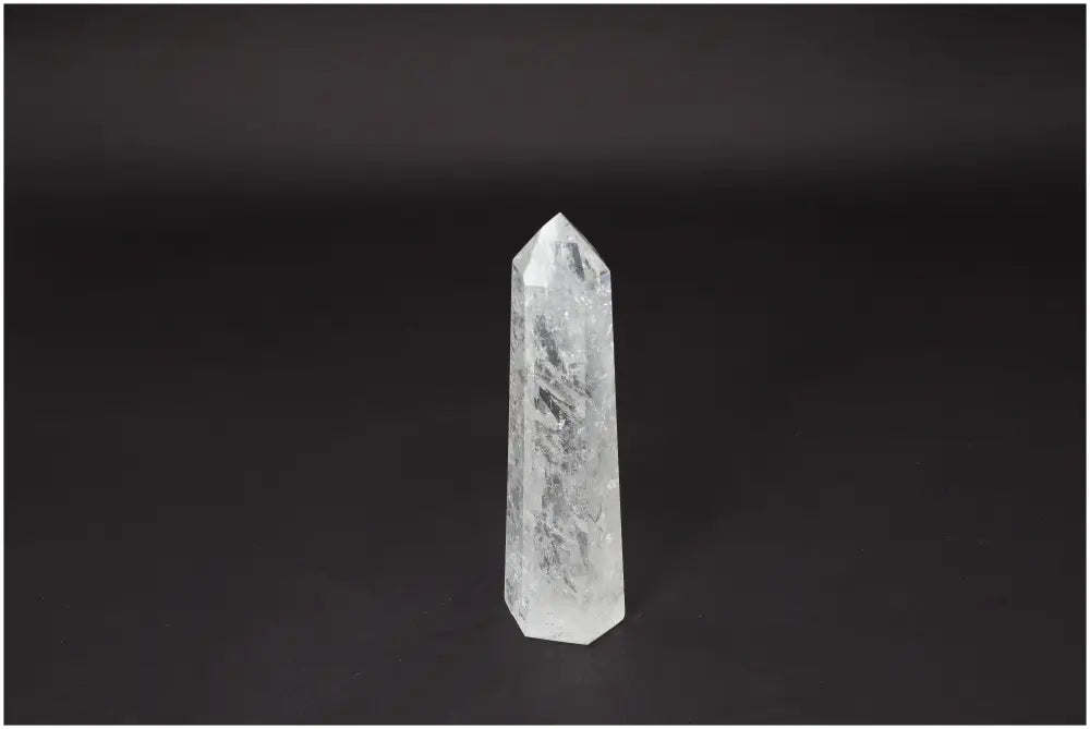Lemurian Quartz obelisk on dark background, symbolizing clarity and balance for personal growth and energy amplification.