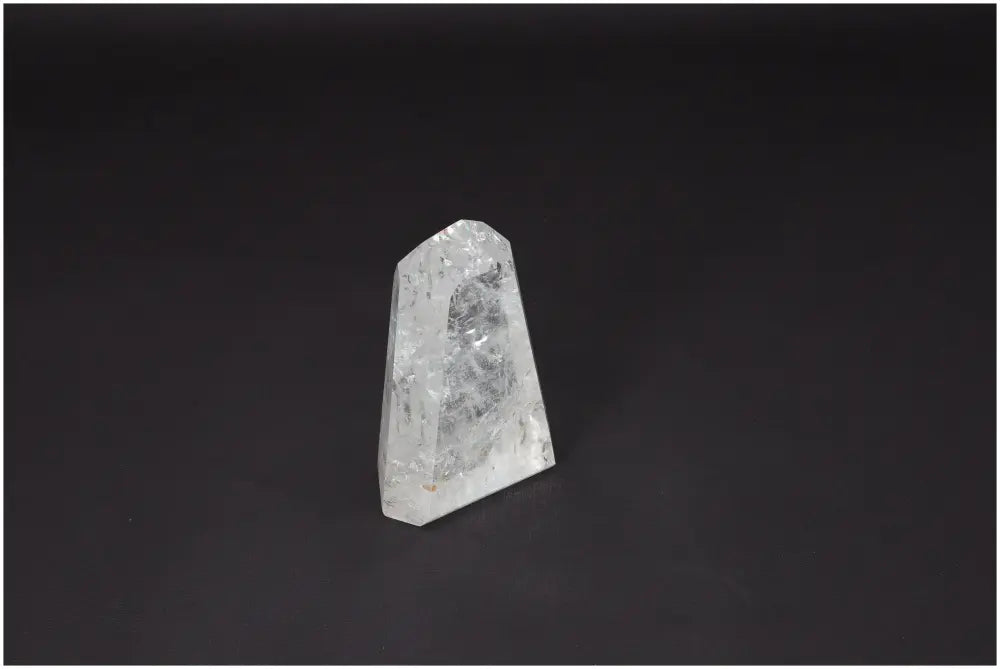 Lemurian Quartz Obelisk on a dark background, perfect for energy amplification and balance, ethically sourced crystal for personal growth.