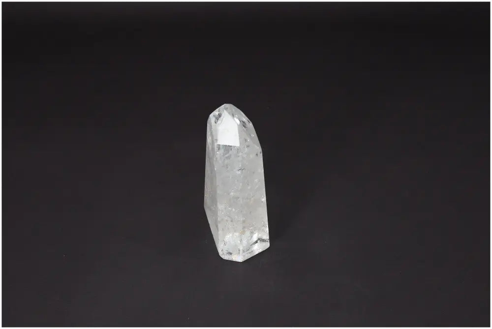 Lemurian Quartz Obelisk crystal on a dark background, symbolizing clarity and balance, ethically sourced and naturally formed.