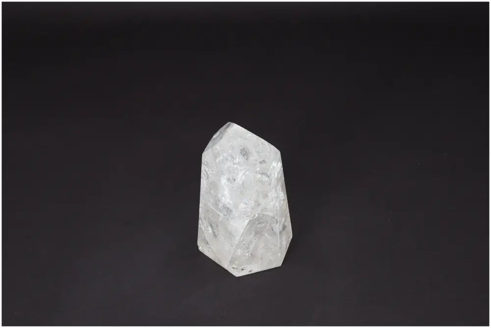 Lemurian Quartz Obelisk crystal on a dark background, showcasing its clarity and natural formation, ideal for energy and personal growth enhancement.