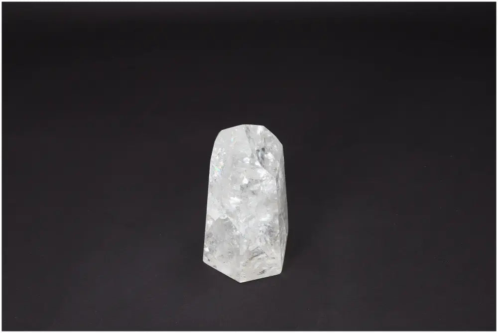 Lemurian Quartz Obelisk on black background, clear quartz crystal for clarity and balance, ethically sourced and naturally formed.
