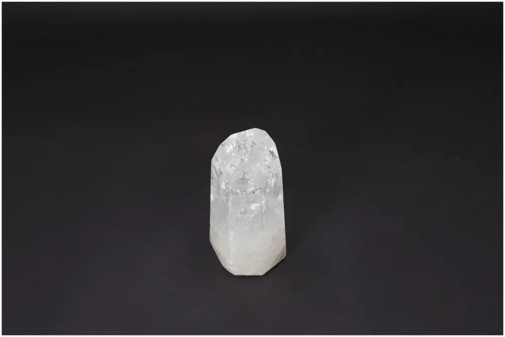 Lemurian Quartz Obelisk on black background, perfect for enhancing clarity, balance, and personal growth through crystal healing.