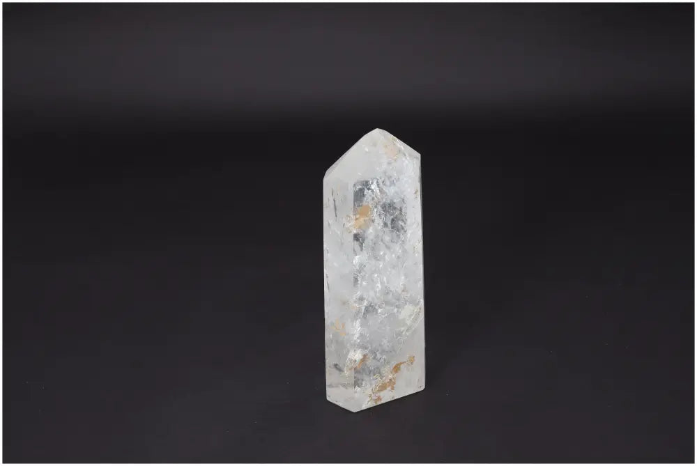 Lemurian Quartz Obelisk on dark background, amplifies energy and intentions as a "Master Healer" crystal for clarity and balance.