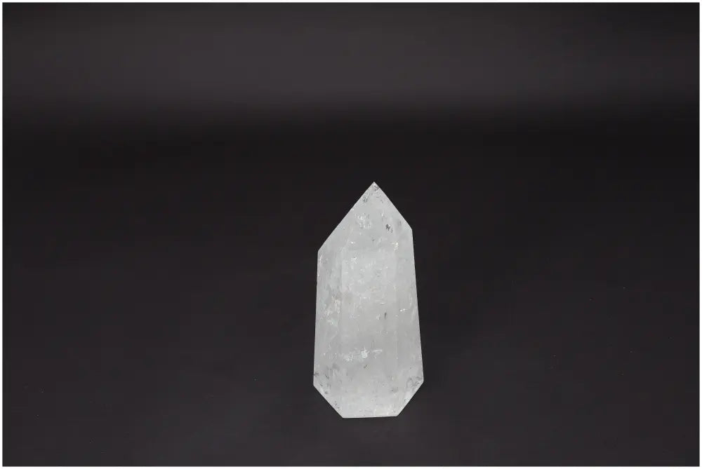 Lemurian Quartz Obelisk - Clear Quartz crystal for clarity and balance, ethically sourced and naturally formed, against a dark background.