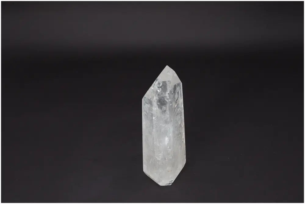 Lemurian Quartz Obelisk on black background, Clear Quartz crystal known as Master Healer for energy and emotional well-being