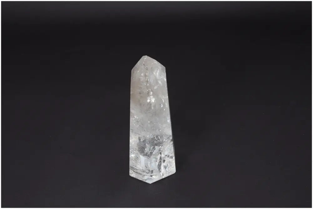 Lemurian Clear Quartz Obelisk crystal for clarity, balance, and personal growth on black background