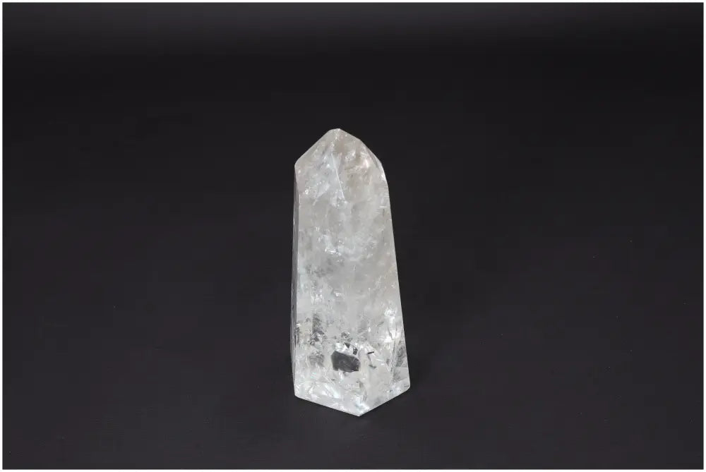 Lemurian Quartz Obelisk against a dark background, symbolizing clarity and energetic amplification.