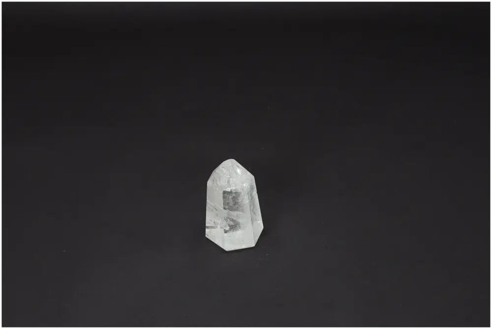 Lemurian Quartz Obelisk on black background, showcasing hand-selected, ethically sourced Clear Quartz for clarity and balance.