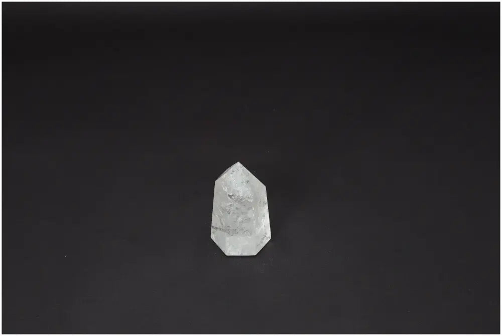 Lemurian Quartz Obelisk on black background, showcasing its natural clarity and beauty as a powerful healing crystal.