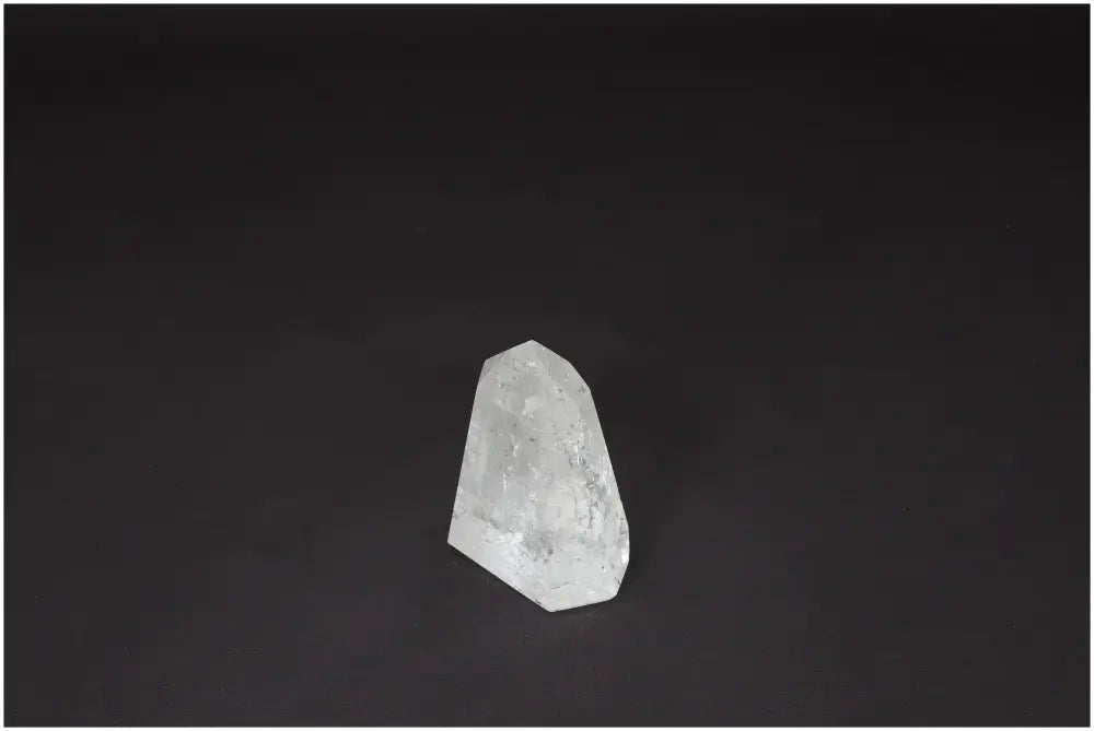 Lemurian Quartz Obelisk on dark background, showcasing its natural clarity and hand-selected quality for energy amplification and balance.