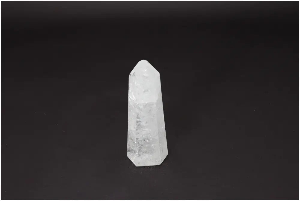 Lemurian Quartz Obelisk crystal on a black background showcasing clarity and balance. Ethically sourced, hand-selected, and naturally formed.